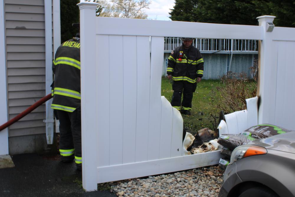 Firefighters work to quell what is left of the fire. Photos by Brandy Muz