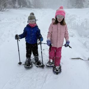 With snow shoes borrowed from the Wareham Free Library, left, 4-year-old John and 7-year-old Maddie Deasy trek the winter wonderland of Wareham. Photo source: Kristen Schmitt